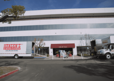 Hansen's Moving and Storage trucks are at large-scale commercial office relocation